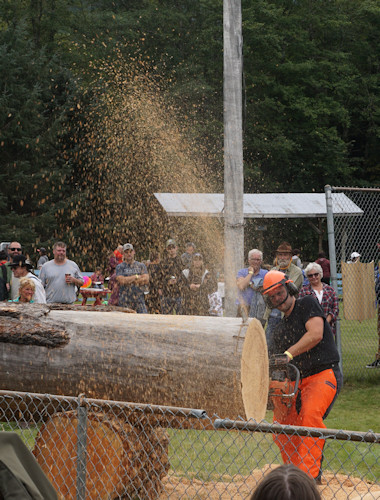 Bella Coola Fall Fair cutting a cookie